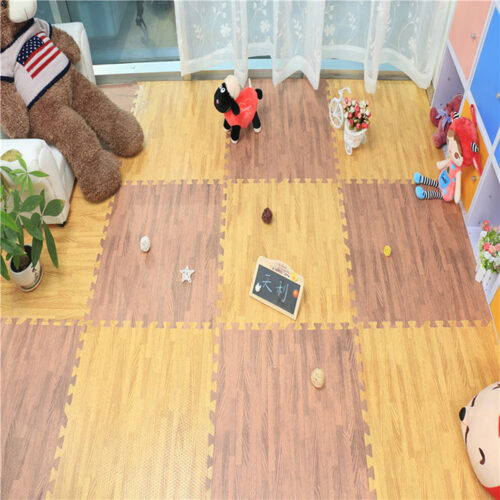 Children’s playroom with interlocking EVA foam tiles in wood print pattern, creating a soft, safe and warm play surface with toys and décor around the room.
