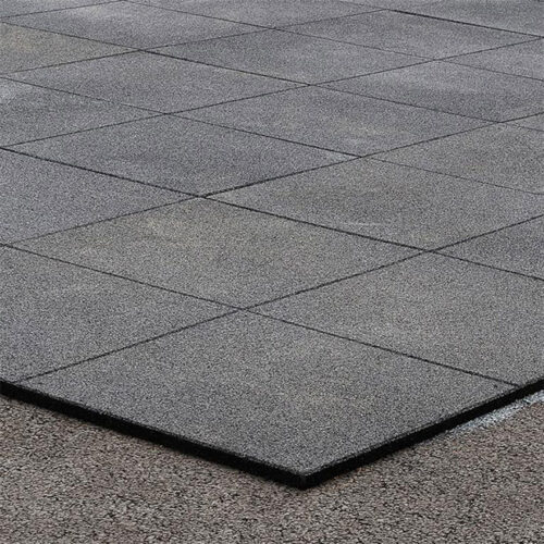 Black rubber playground tiles 1×1 m installed on outdoor surface