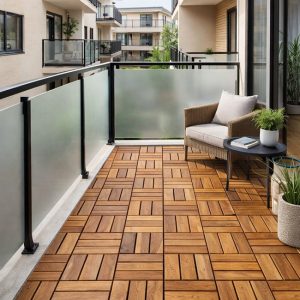 Balcony with interlocking wood deck tiles, glass railing and outdoor chair in a modern apartment setting.