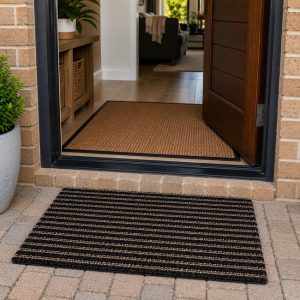 Outdoor brush mat and indoor entrance mat at a South African home entrance