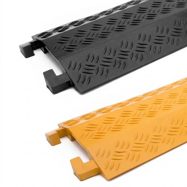 Black and yellow interlocking drop over cable covers for protecting cables across walkways and light vehicle crossings.