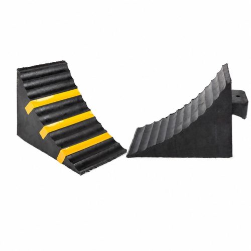 Black rubber wheel chocks with and without yellow reflective strips
